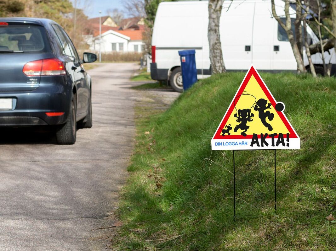 Lekande barn - varningsskylt med logotyp